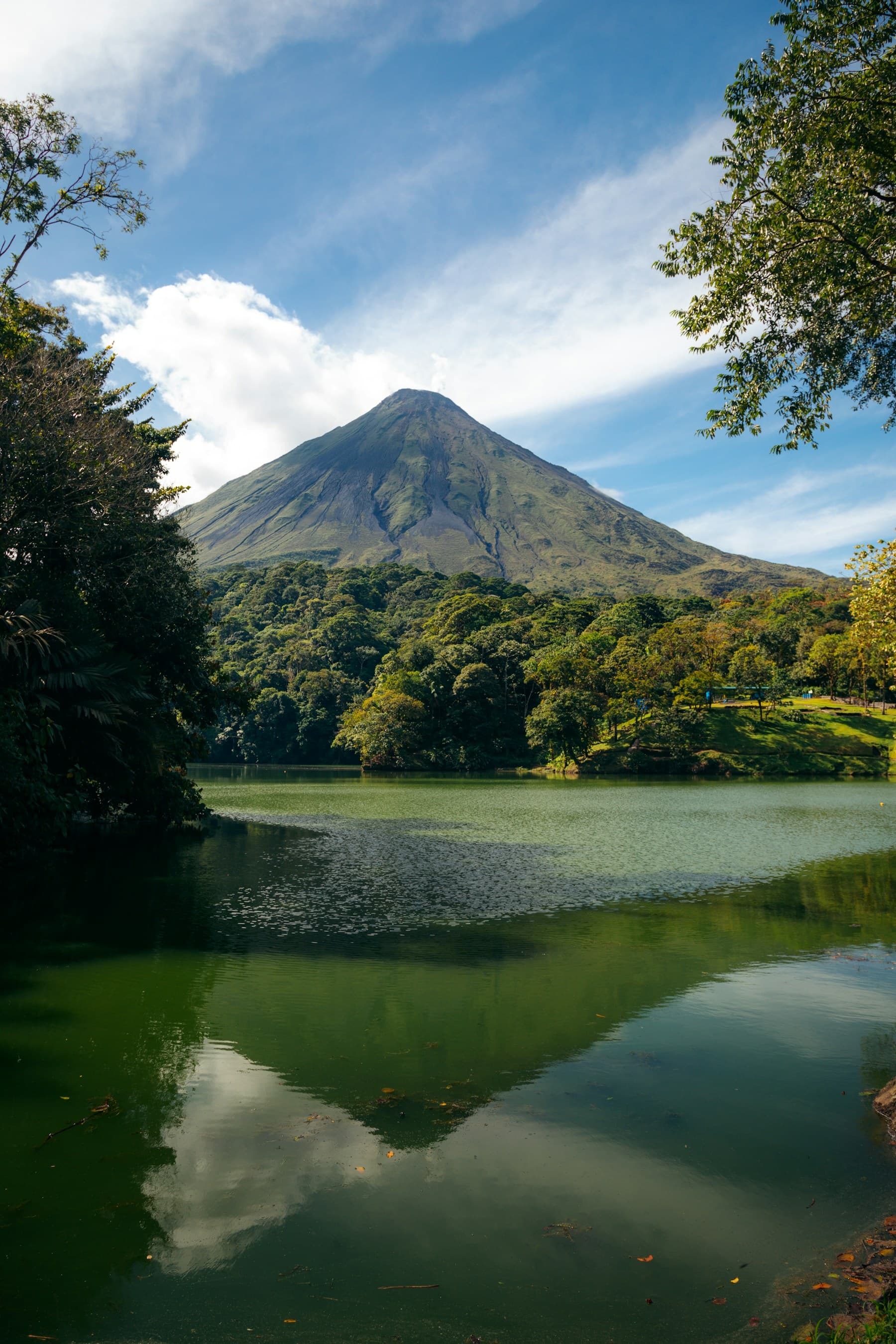 Lake surrounded by forest and mountains in Costa Rica
