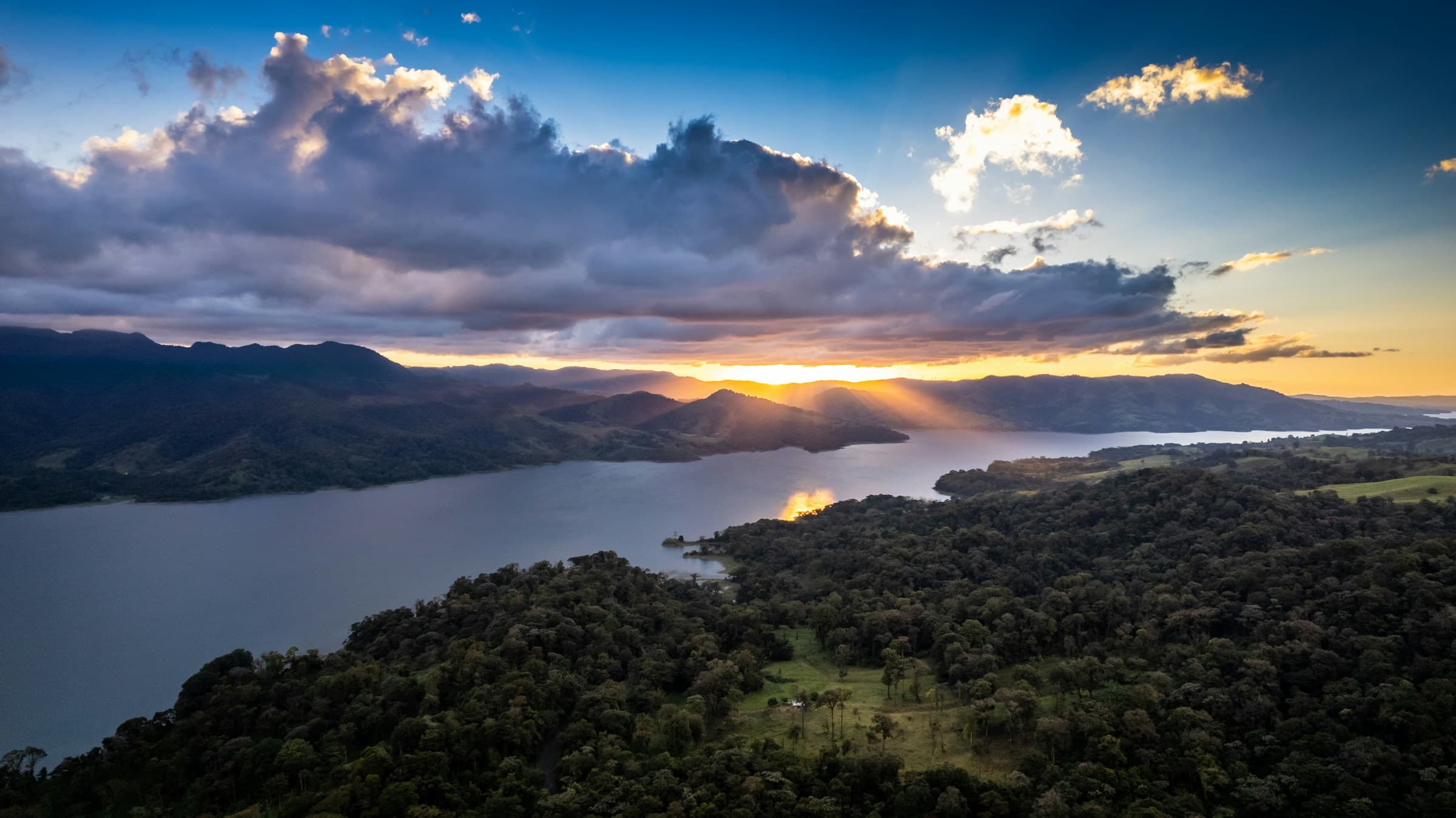 Sunset over a Costa Rican lake and mountains
